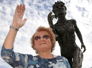 The original nymph, Geneice Scott, standing in front of a nymph statue in Adelaide in 2007. [Image crecit: perthnow.com.au]